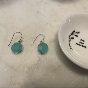 Blue earrings with silver accent.
